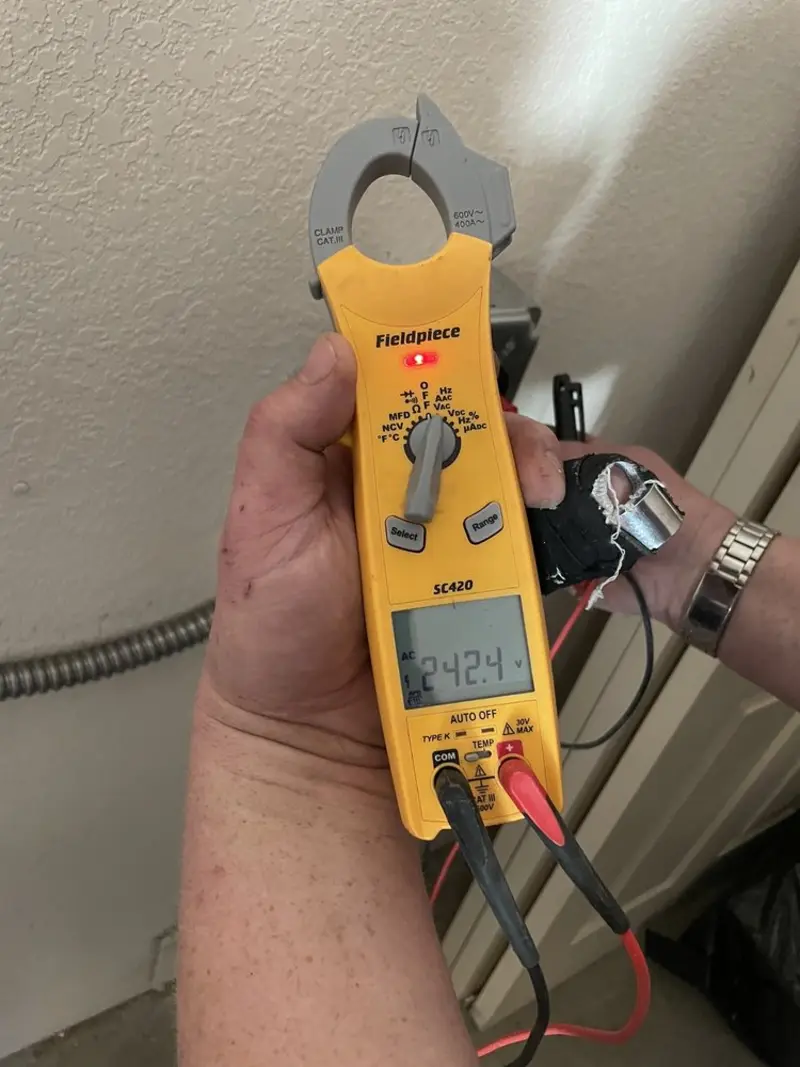 Voltage testing with clamp meter during Ceiling Fan Installation in Lafayette